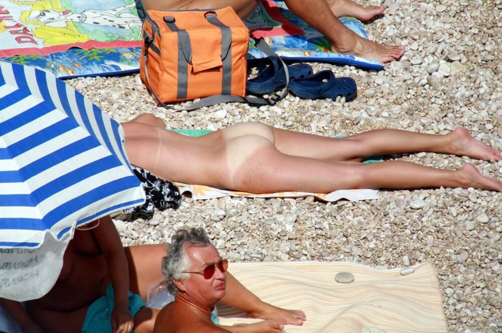 Naturists Beach Relaxation pics - The practice of nudity within a community